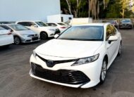 2018 Toyota Camry Ascent Hybrid Sedan in White.