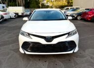 2018 Toyota Camry Ascent Hybrid Sedan in White.