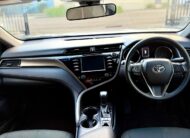 2018 Toyota Camry Ascent Hybrid Sedan in White.
