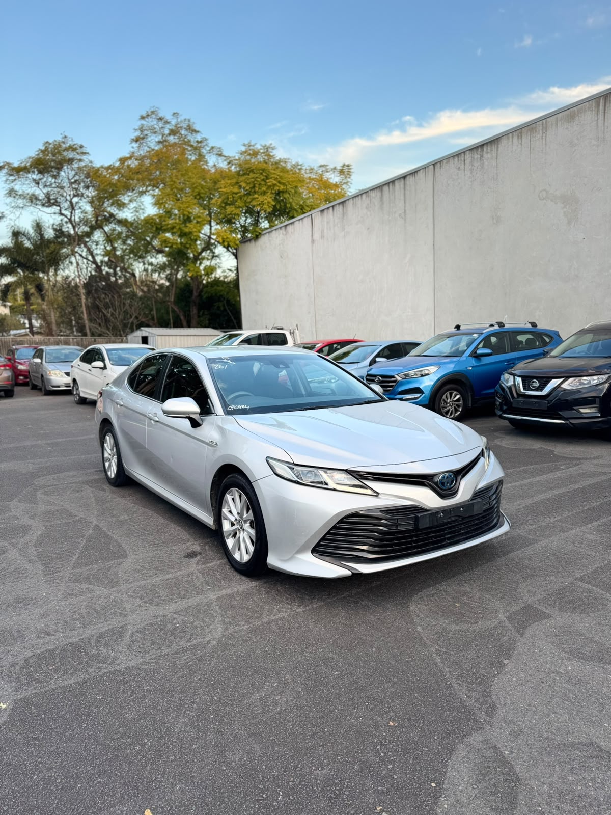 2019 Toyota Camry Ascent Sport Hybrid Sedan in Silver.