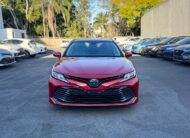 2020 Toyota Camry Ascent Sedan in Red.