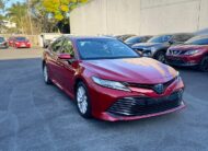 2020 Toyota Camry Ascent Sedan in Red.
