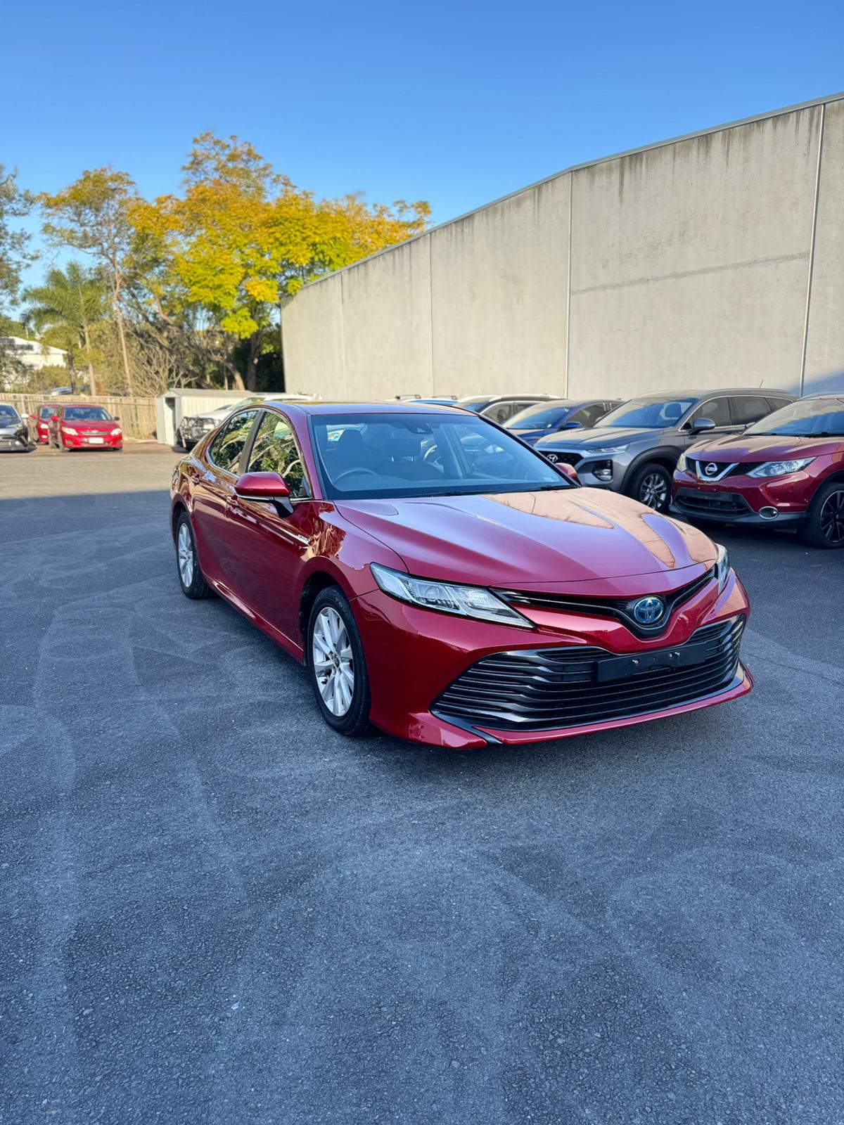 2020 Toyota Camry Ascent Sedan in Red.