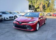 2020 Toyota Camry Ascent Sedan in Red.