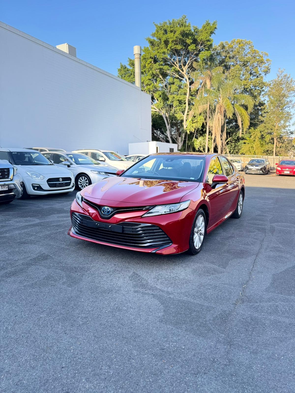 2020 Toyota Camry Ascent Sedan in Red.