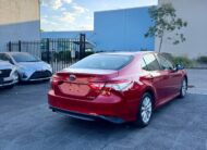 2020 Toyota Camry Ascent Sedan in Red.