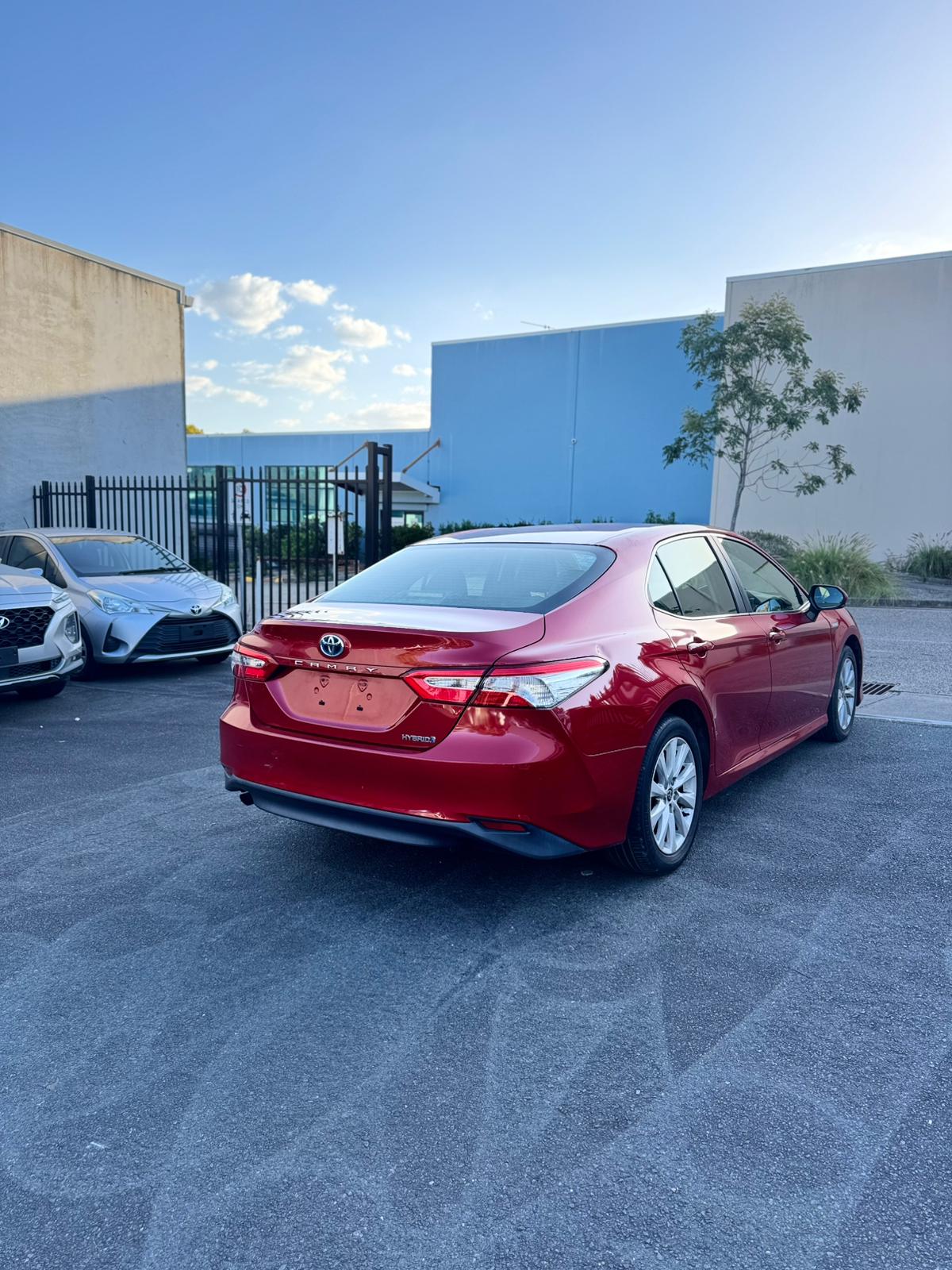 2020 Toyota Camry Ascent Sedan in Red.