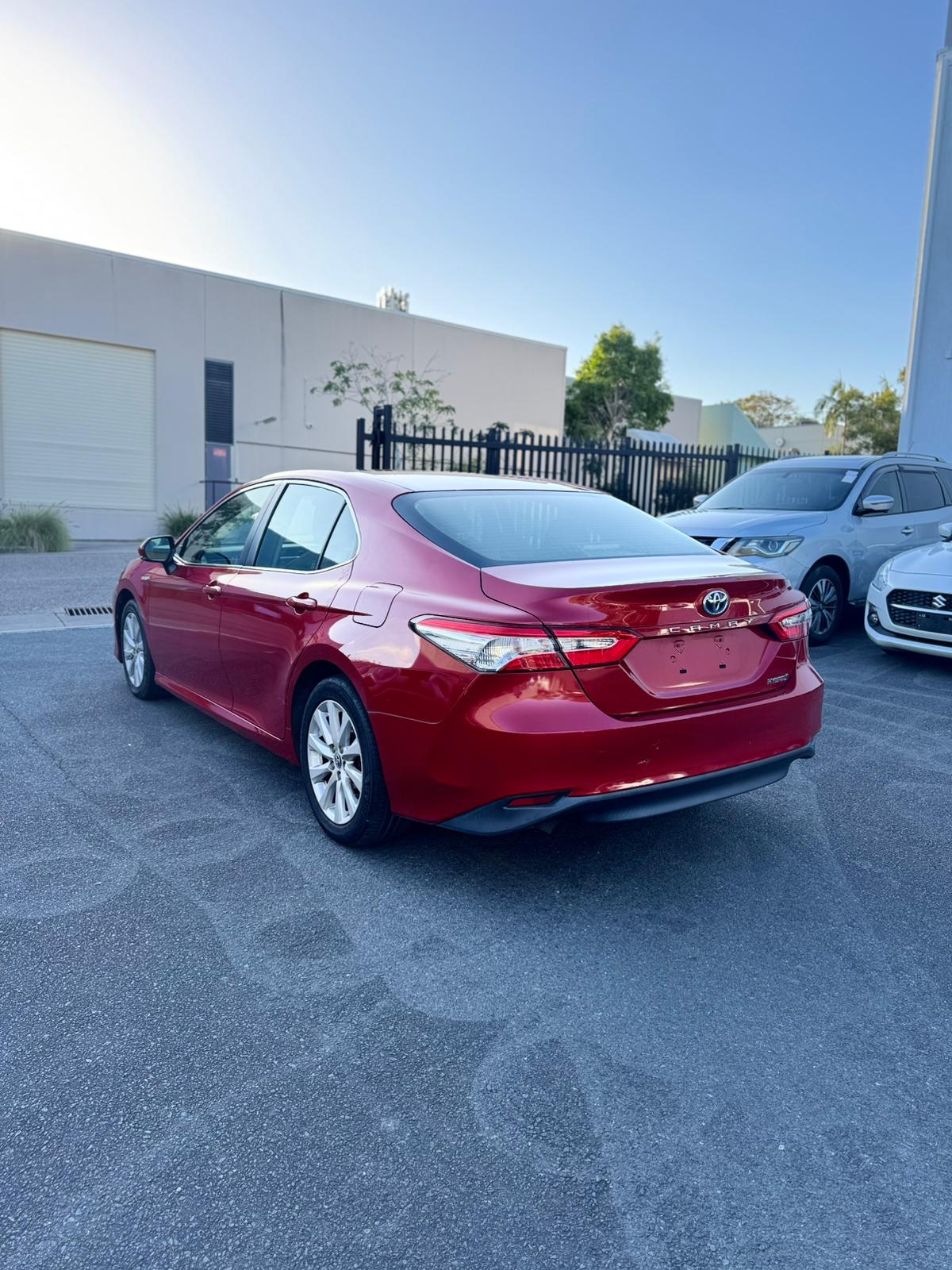 2020 Toyota Camry Ascent Sedan in Red.