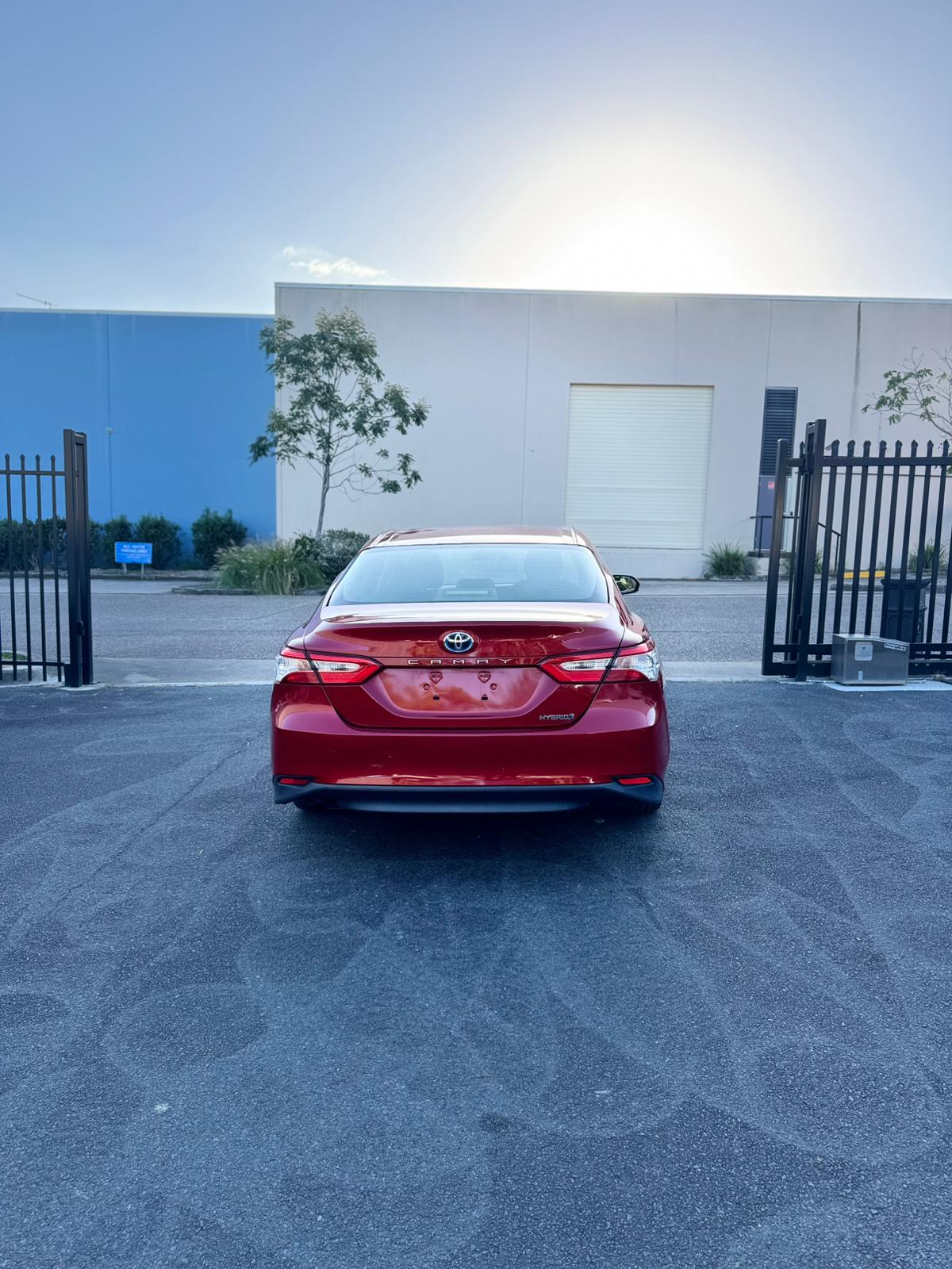 2020 Toyota Camry Ascent Sedan in Red.