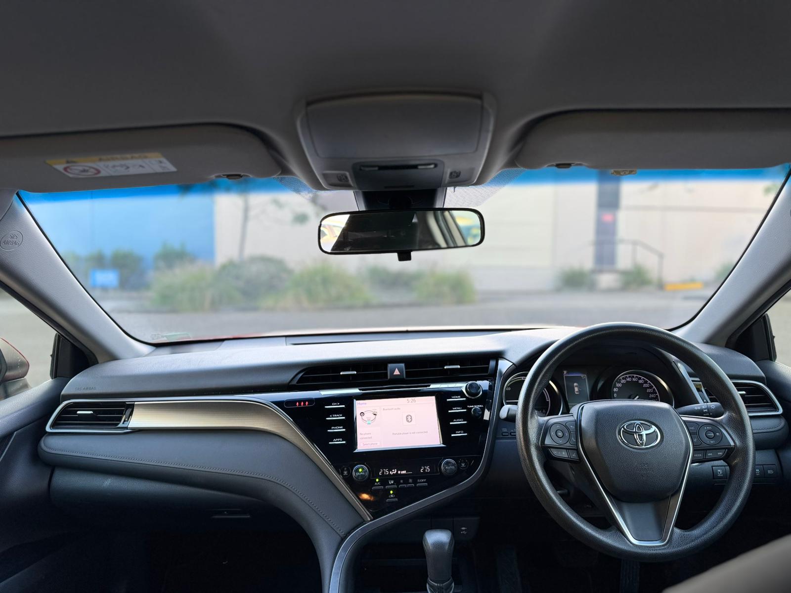 2020 Toyota Camry Ascent Sedan in Red.