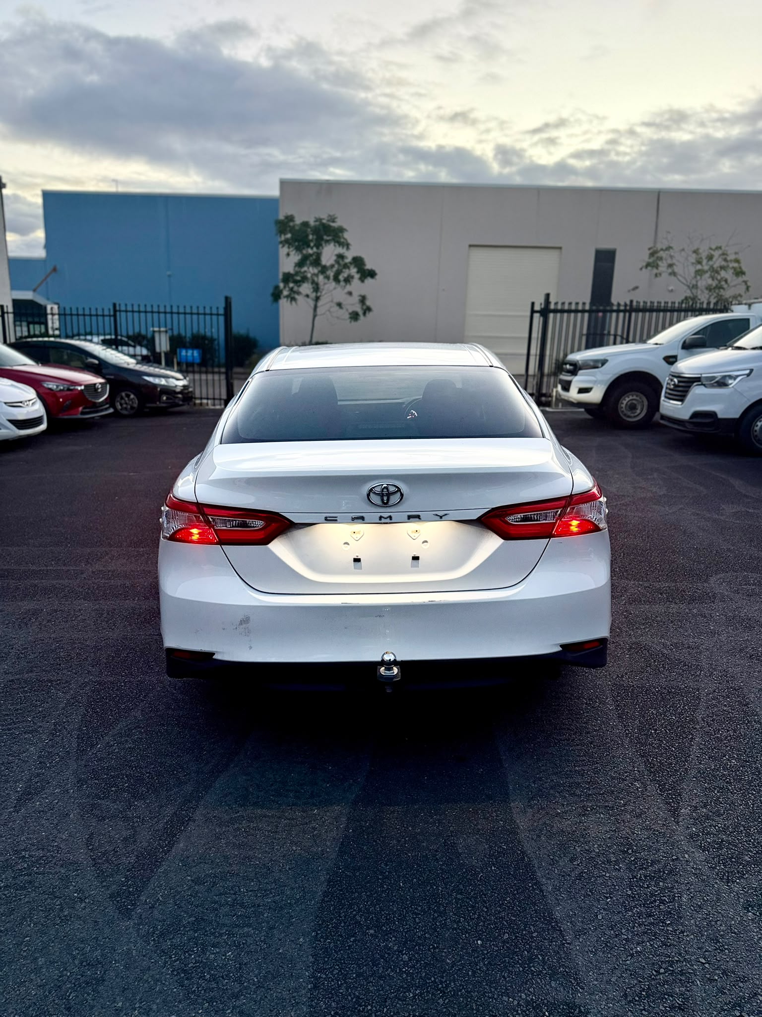 2020 Toyota Camry Ascent Sedan in White.