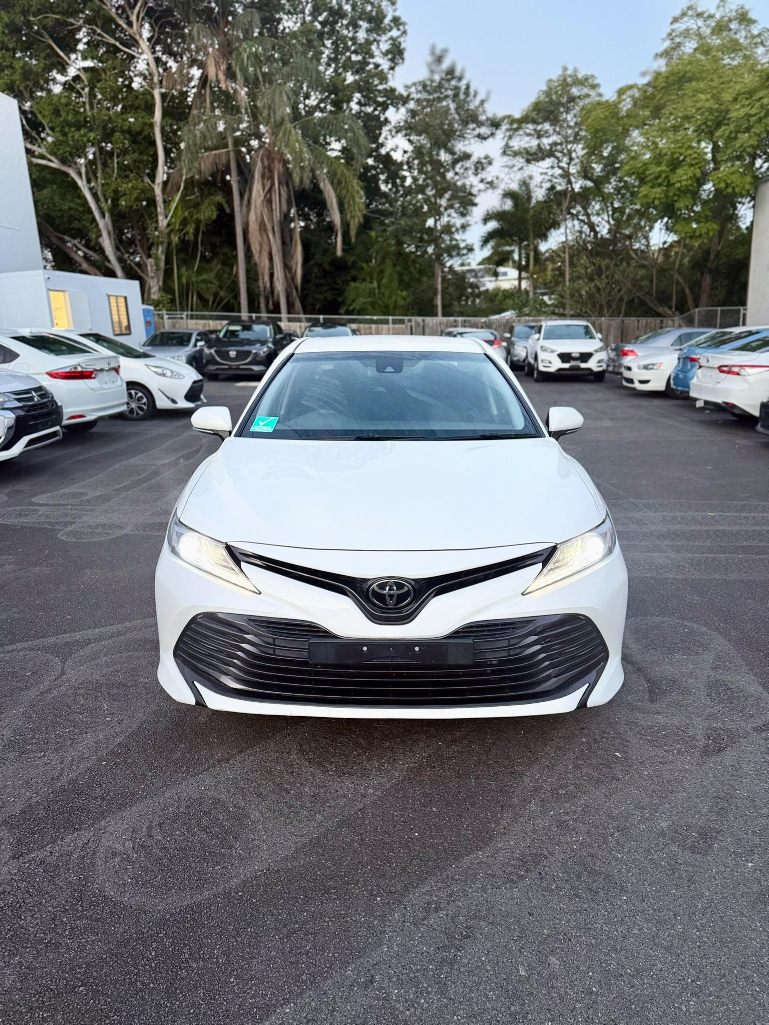 2020 Toyota Camry Ascent Sedan in White.