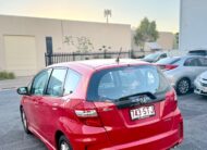 2012 Honda Jazz VTi GE MY12 Hatchback in Red.