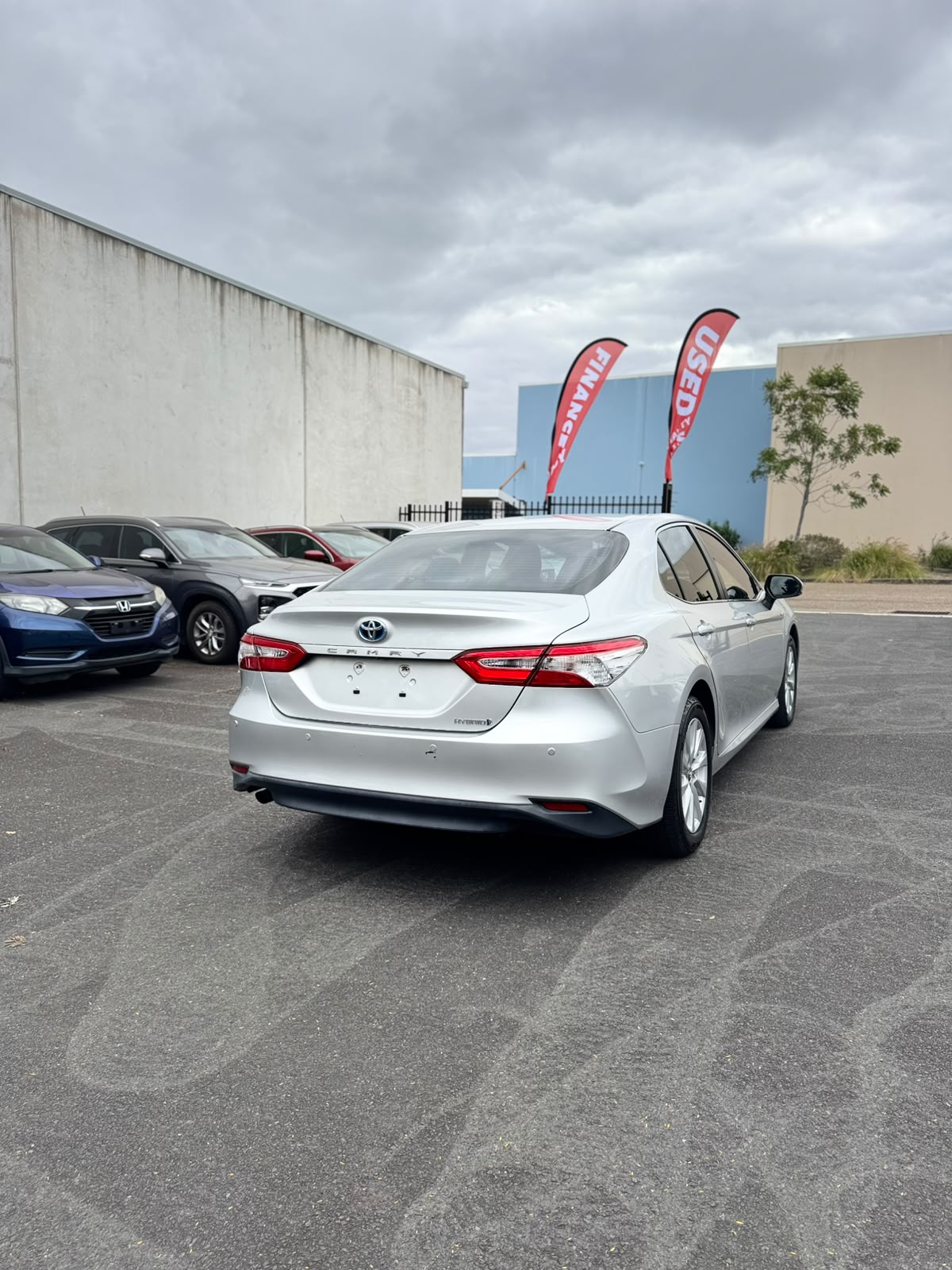 2019 Toyota Camry Ascent Hybrid Sedan in Sunrise.