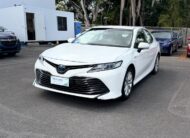 2019 Toyota Camry Ascent Hybrid Sedan in White.
