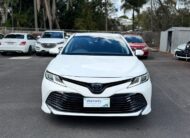 2019 Toyota Camry Ascent Hybrid Sedan in White.