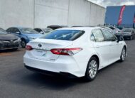 2019 Toyota Camry Ascent Hybrid Sedan in White.