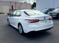2019 Toyota Camry Ascent Hybrid Sedan in White.