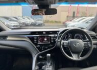 2019 Toyota Camry Ascent Hybrid Sedan in White.