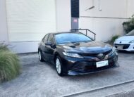 2020 Toyota Camry Ascent Hybrid Sedan in Brown.