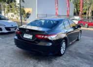 2020 Toyota Camry Ascent Hybrid Sedan in Brown.