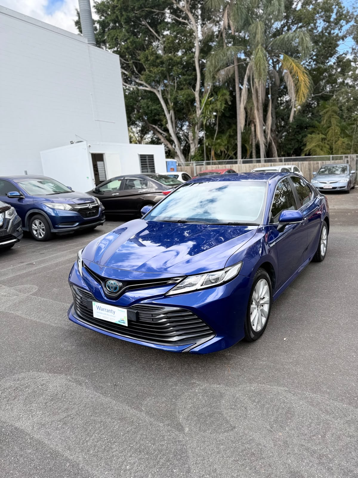 2020 Toyota Camry Ascent Hybrid Sedan in Blue.