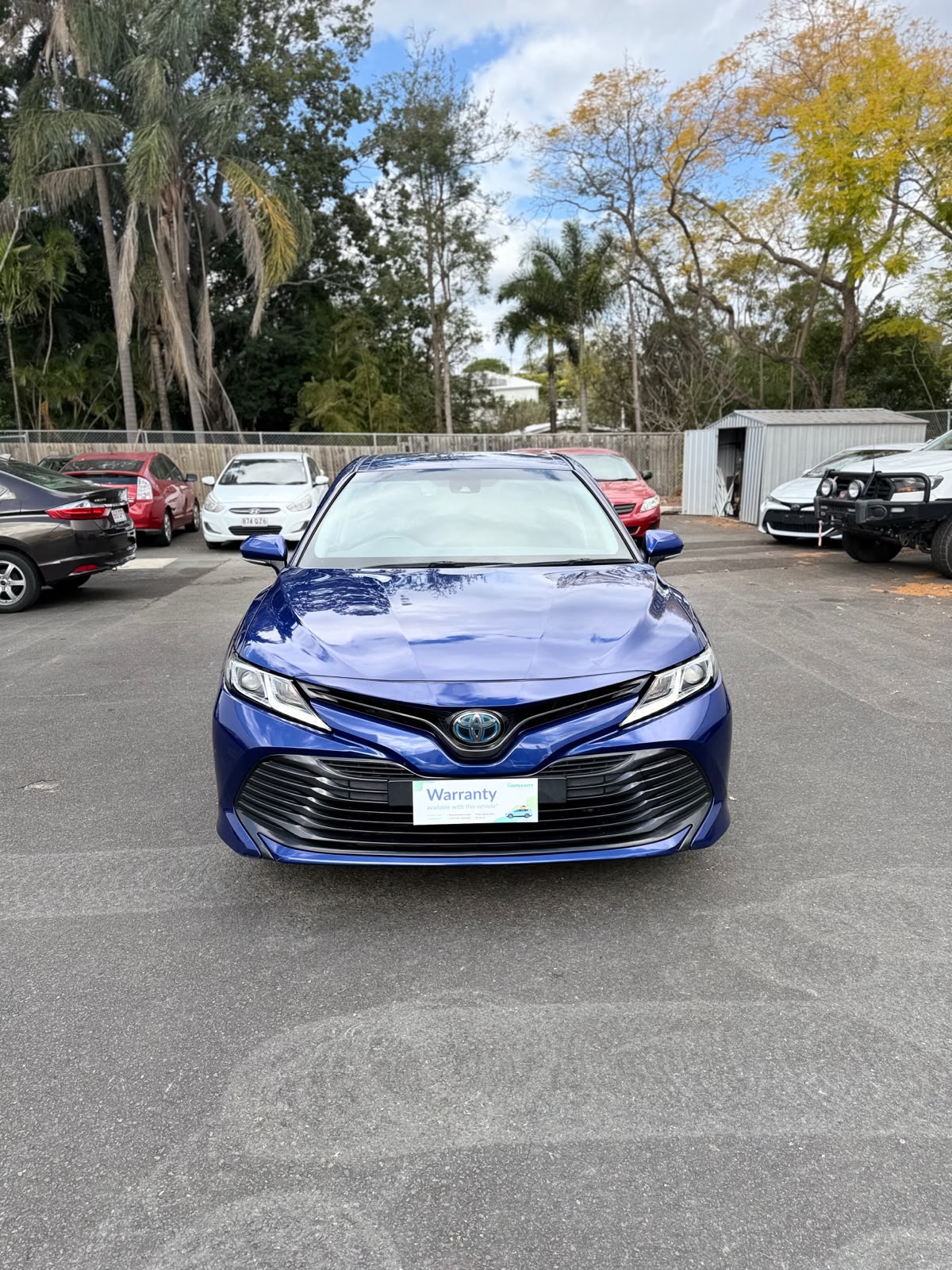 2020 Toyota Camry Ascent Hybrid Sedan in Blue.