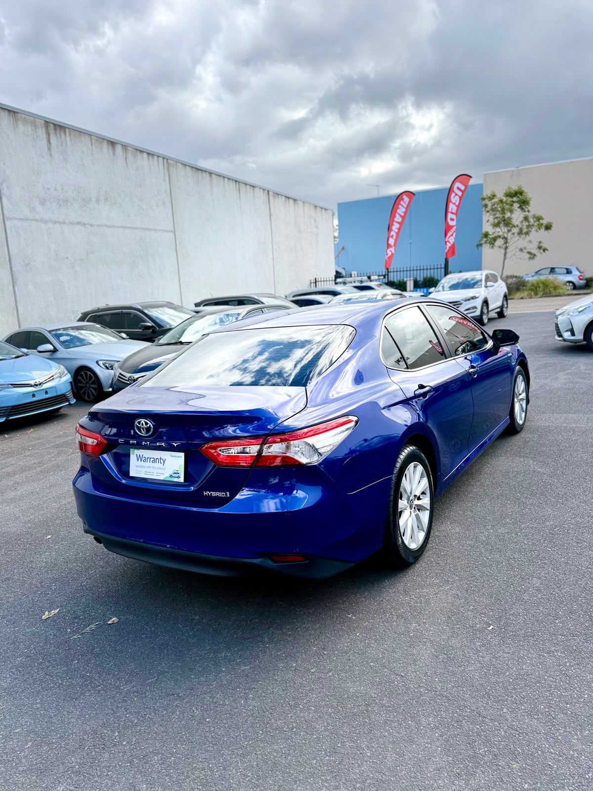 2020 Toyota Camry Ascent Hybrid Sedan in Blue.