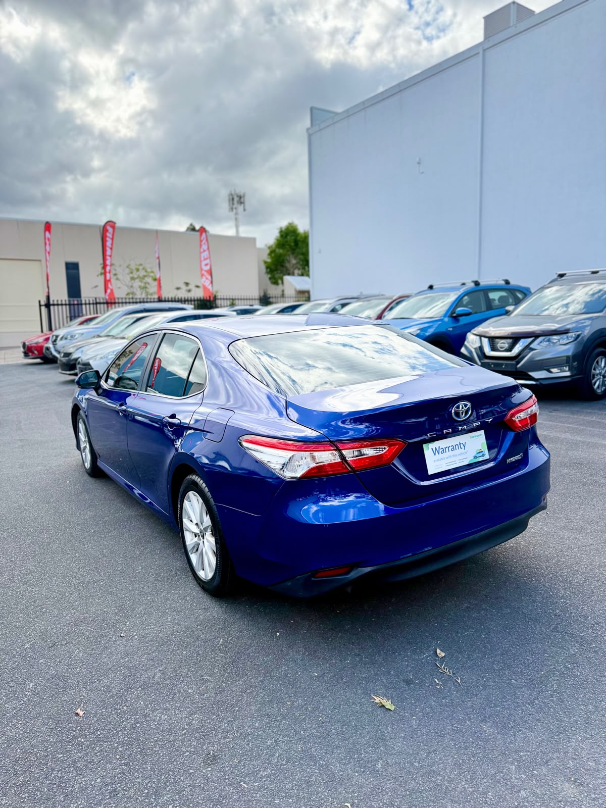2020 Toyota Camry Ascent Hybrid Sedan in Blue.