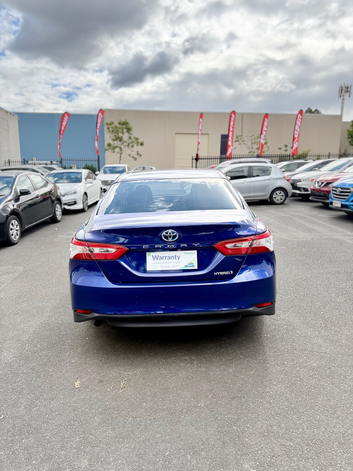 2020 Toyota Camry Ascent Hybrid Sedan in Blue.