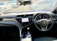 2020 Toyota Camry Ascent Hybrid Sedan in Blue.