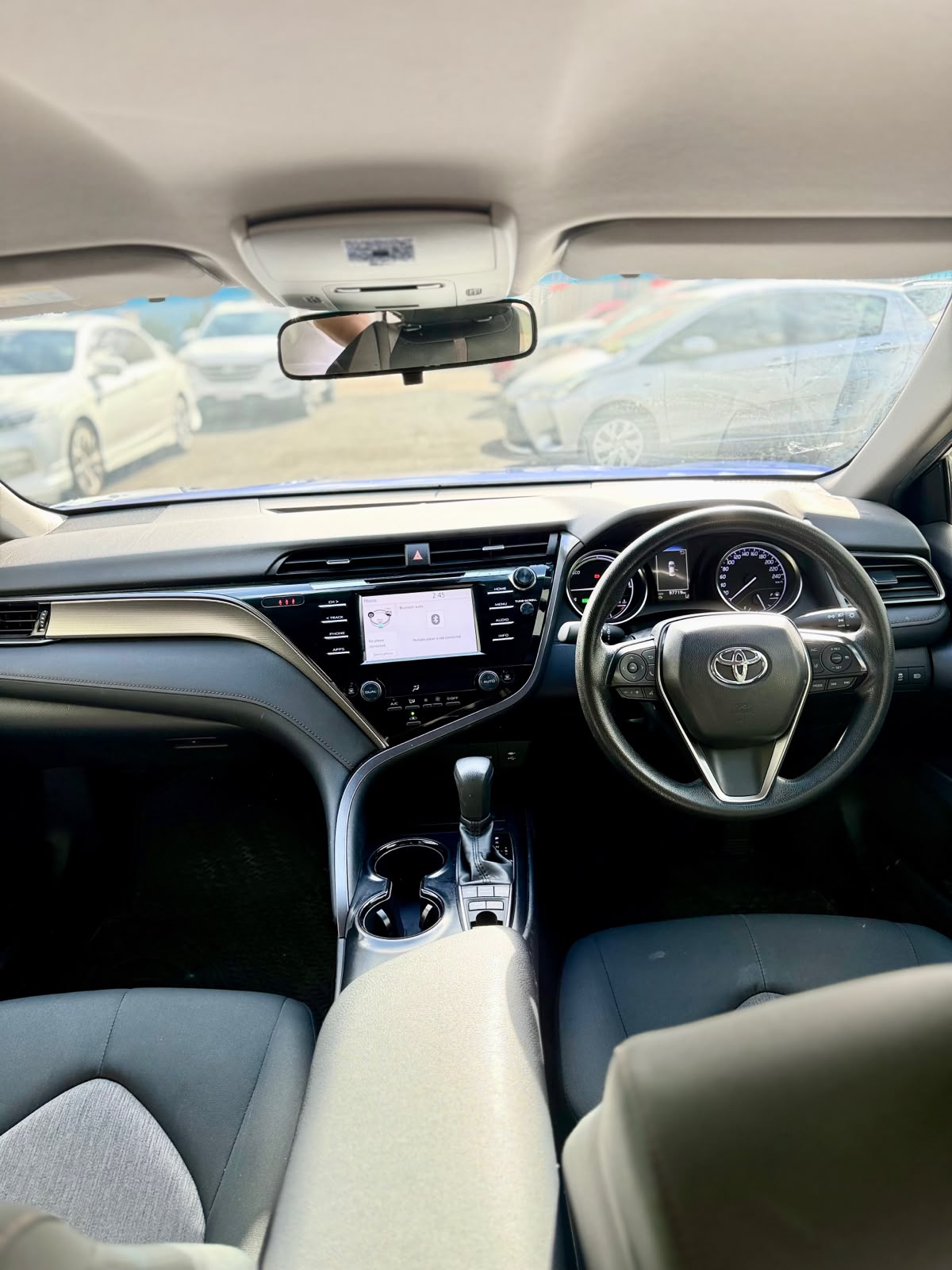2020 Toyota Camry Ascent Hybrid Sedan in Blue.