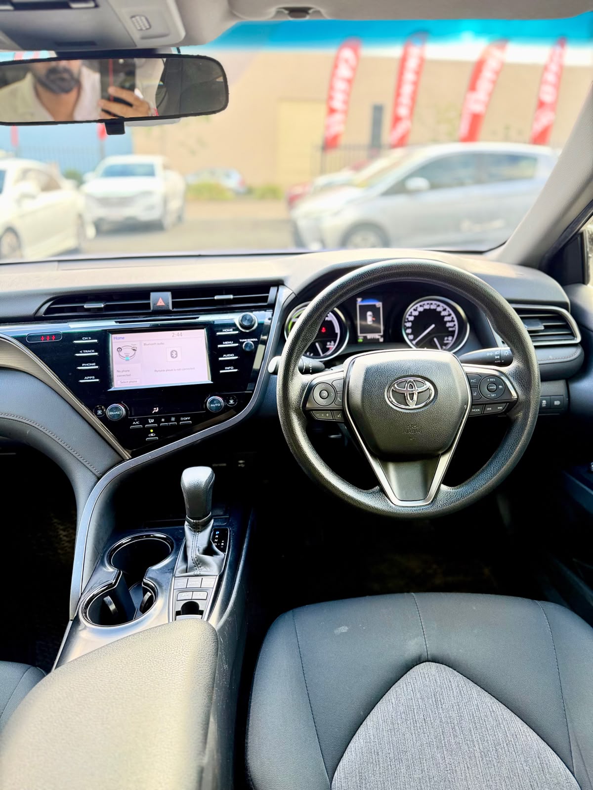 2020 Toyota Camry Ascent Hybrid Sedan in Blue.