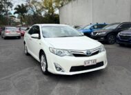 2013 Toyota Camry Hybrid HL Sedan in White.