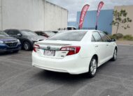2013 Toyota Camry Hybrid HL Sedan in White.