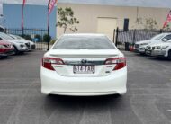 2013 Toyota Camry Hybrid HL Sedan in White.