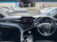 2021 Toyota Camry Hybrid Ascent Sedan in White.
