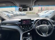 2021 Toyota Camry Hybrid Ascent Sedan in White.